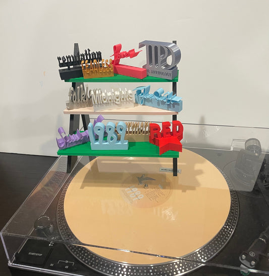 Our vinyl charms stand!
