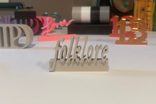 Folklore charm for record collectors or accessorizing Swifties