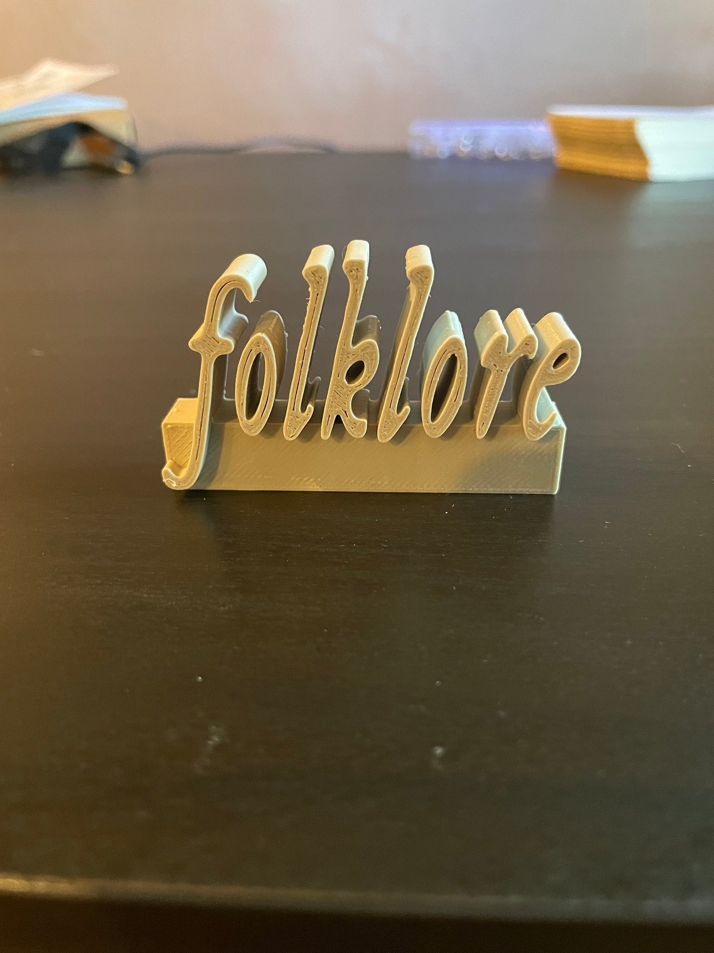 Folklore charm for record collectors or accessorizing Swifties