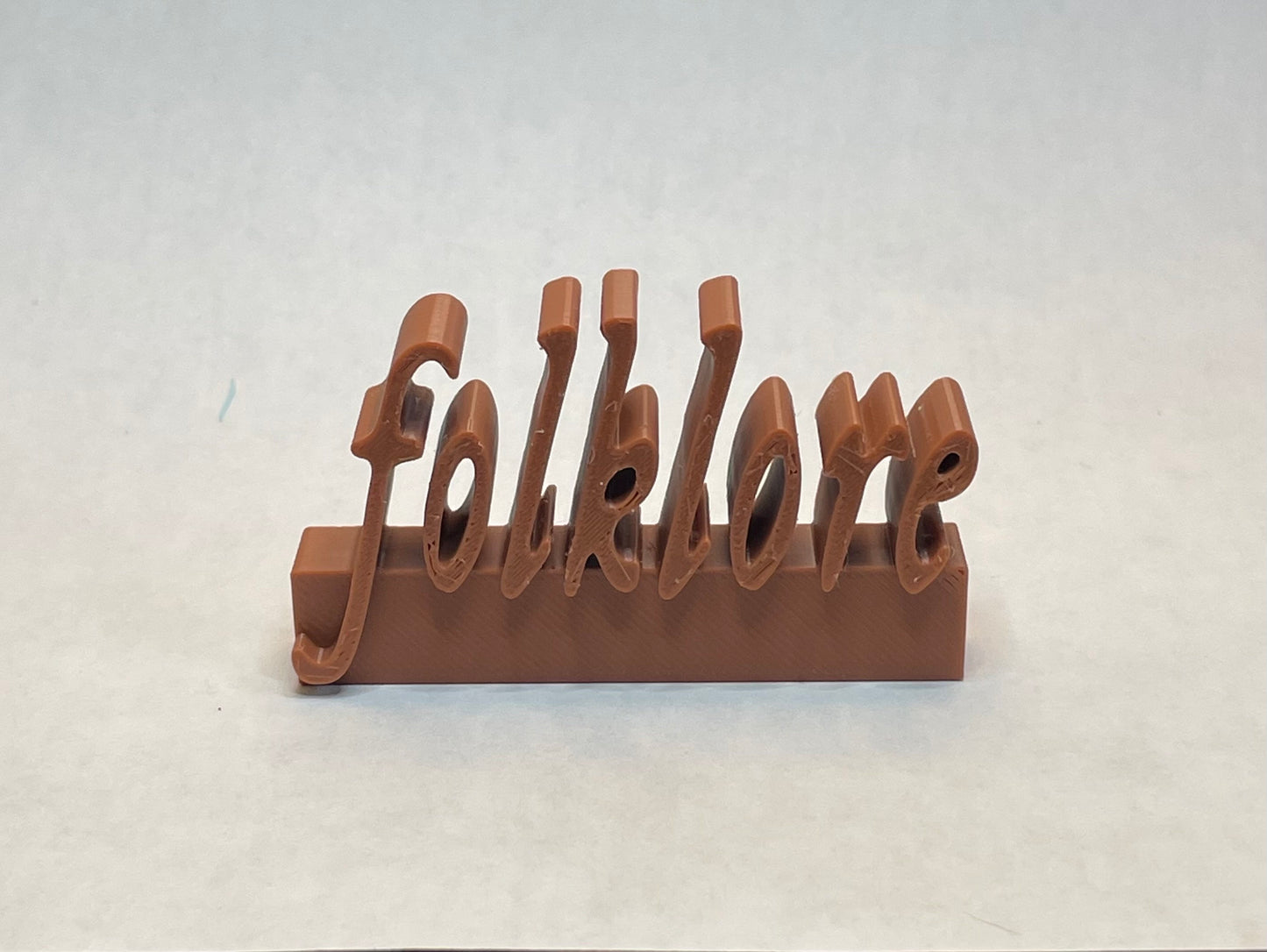 Folklore charm for record collectors or accessorizing Swifties
